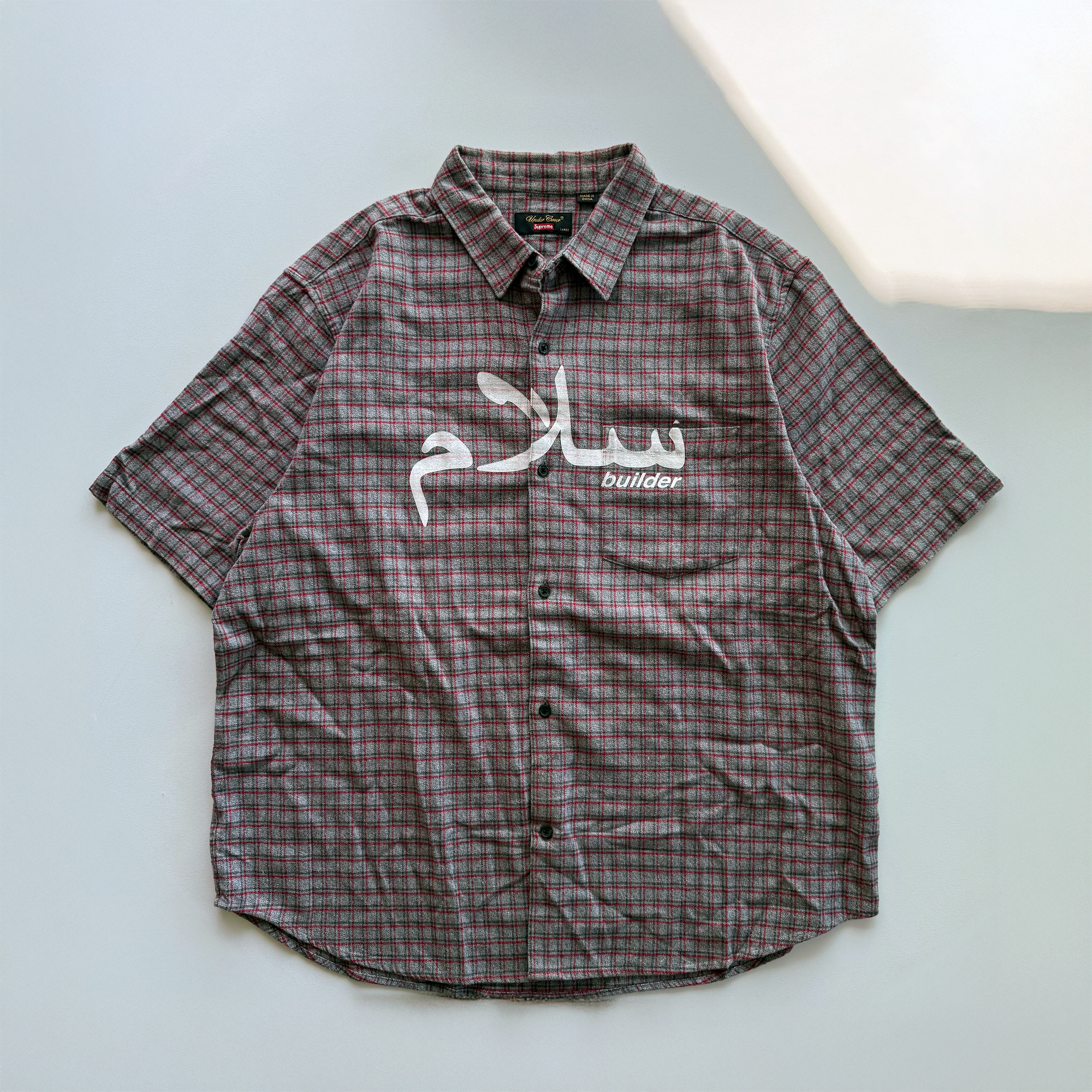 Supreme × Undercover SS23 Arabic Builder Flannel Shirt