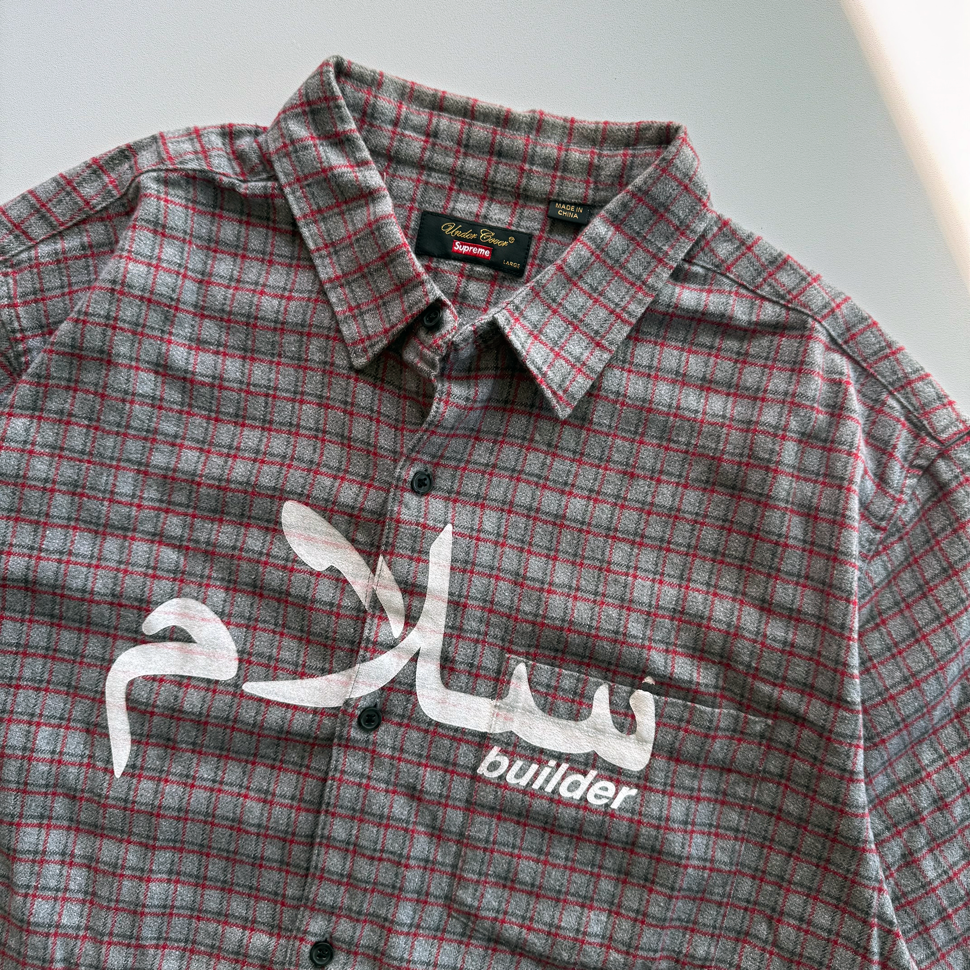 Supreme × Undercover SS23 Arabic Builder Flannel Shirt