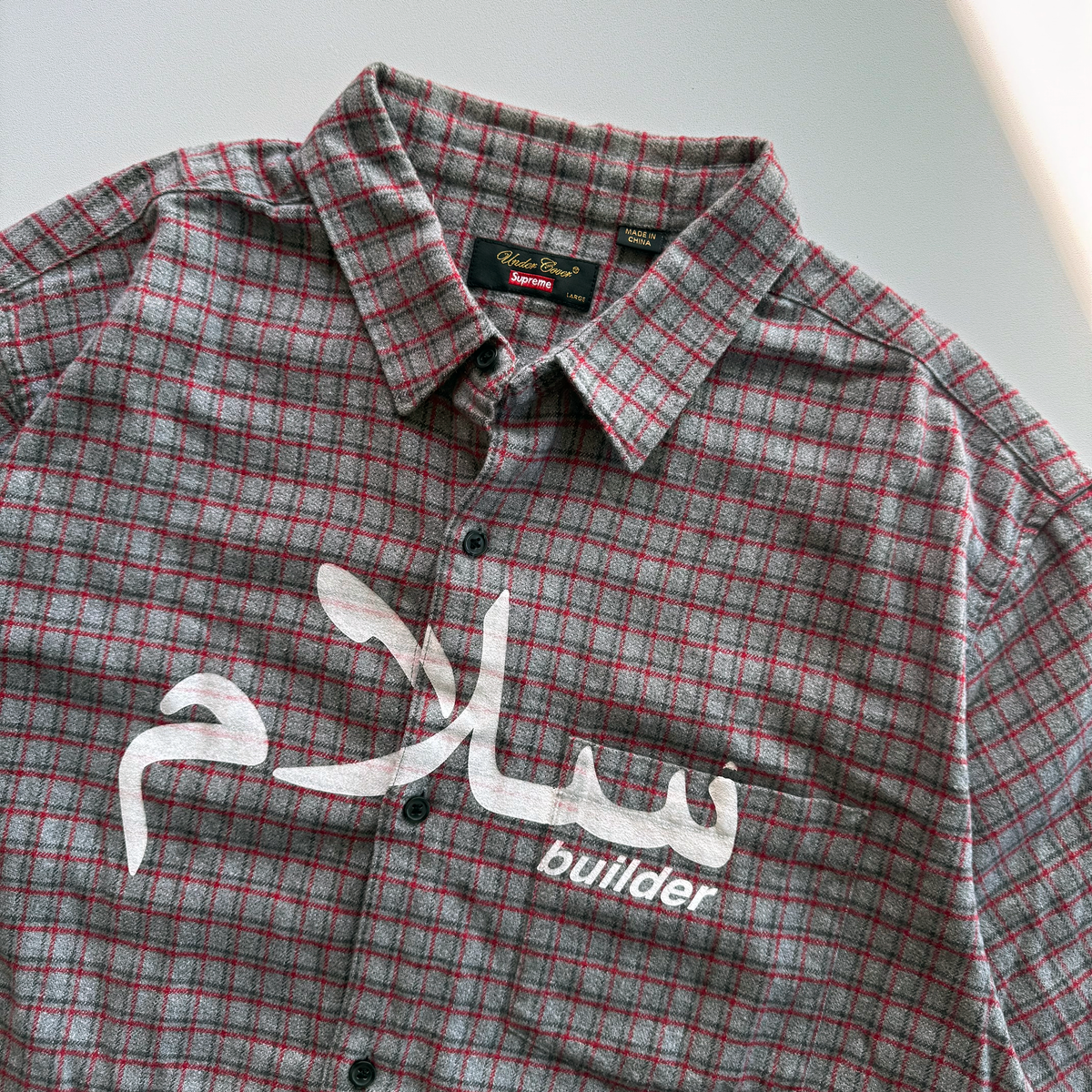Supreme × Undercover SS23 Arabic Builder Flannel Shirt